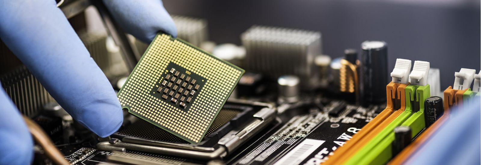 Person expertly placing a computer chip