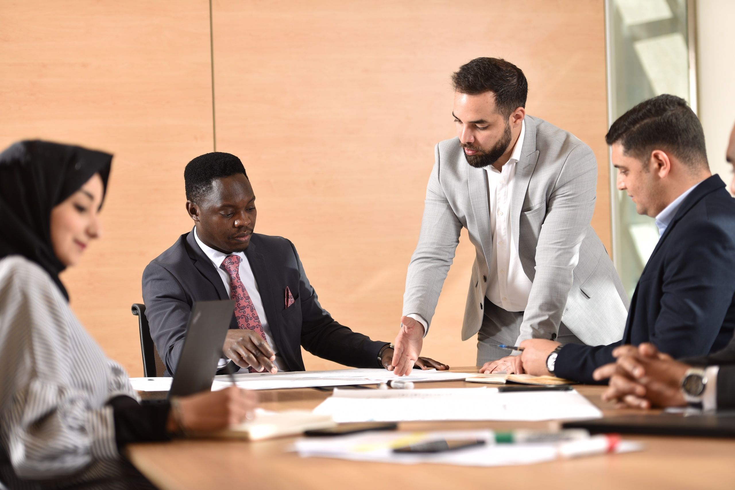 Four people attending a business meeting