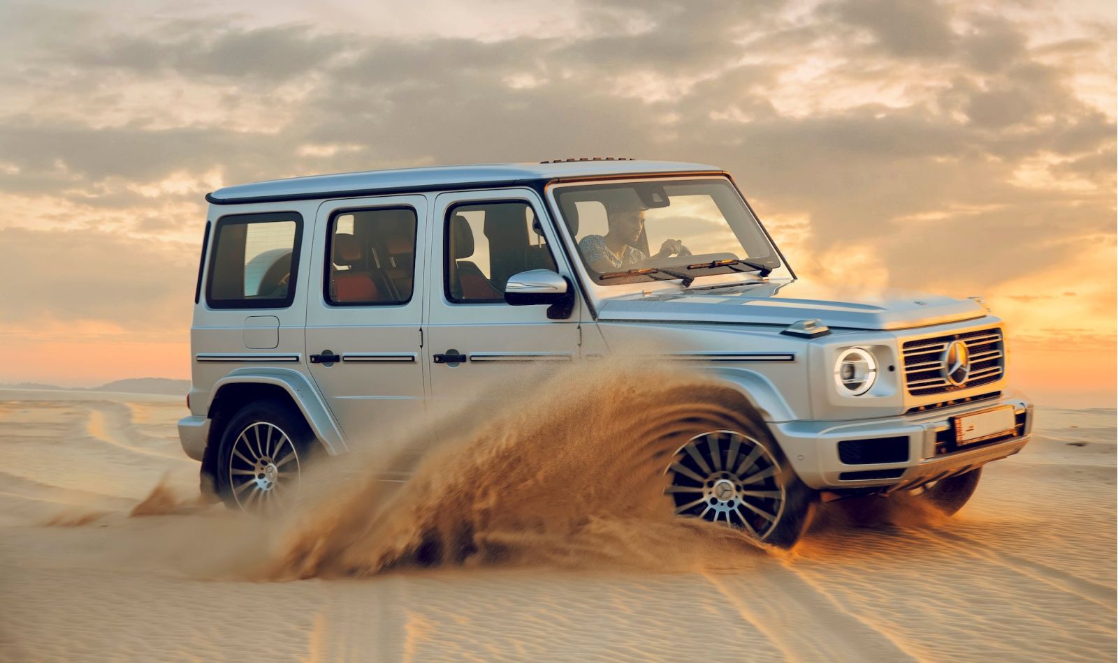 SUV vehicle driving in the sand dunes